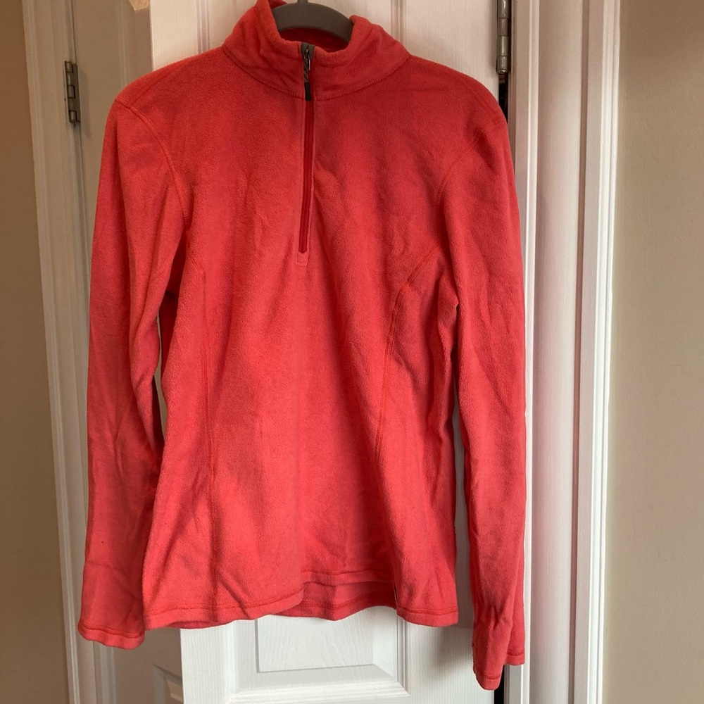 REI half-zip fleece in bright coral